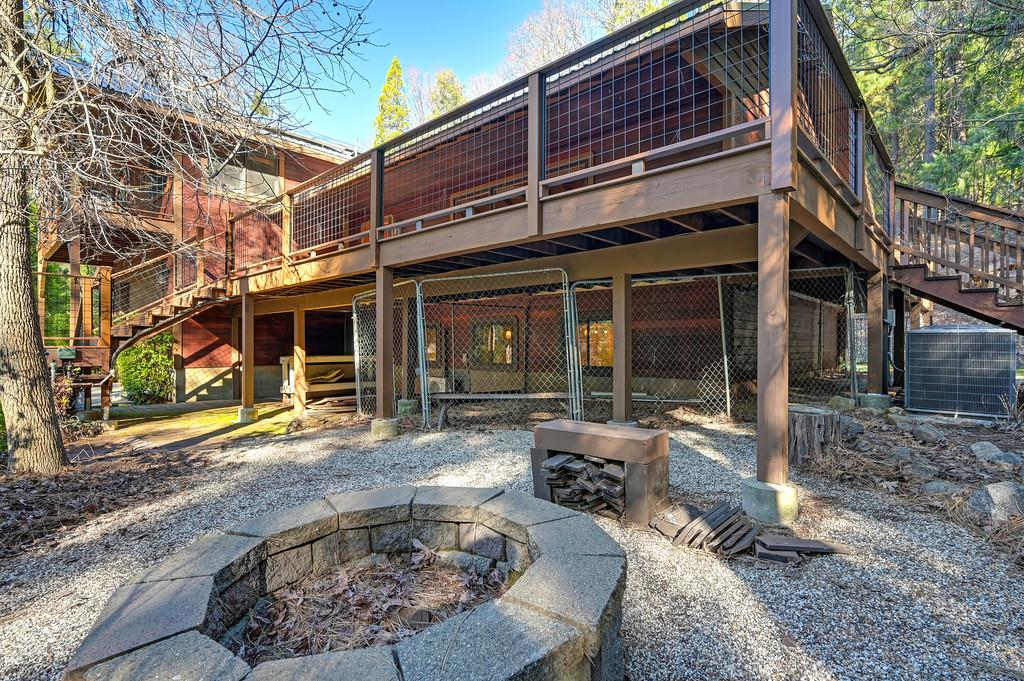 575 Frost Hill Road Alta, CA 95701 - Photo 69 of 82 Firepit area and chain fencing for the dogs if needed or wanted.