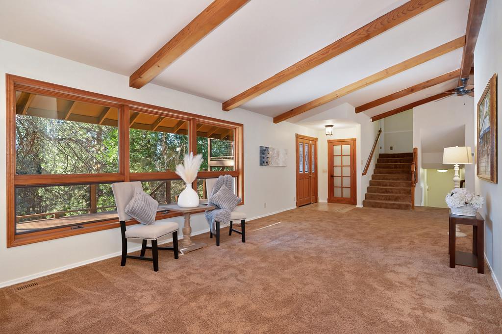 575 Frost Hill Road Alta, CA 95701 - Photo 8 of 82 Living Room: Looking towards the front door. the upper staircase leads up to the Master Bedroom, remodeled master bathroom, 2 additional bedrooms, and hall full bathroom. To the right of the upper staircase the staircase leads to the private bedroom, remodeled bathroom and remodeled laundry room.