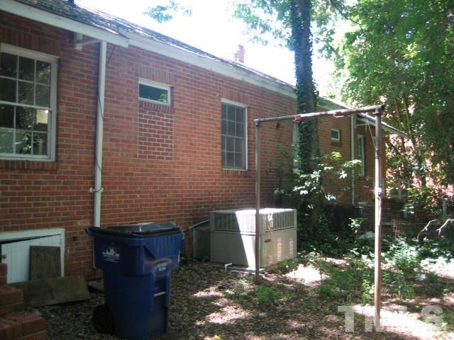 216 Colleton Road Raleigh, NC 27610 - Photo 11 of 11 a side view of a house with a yard