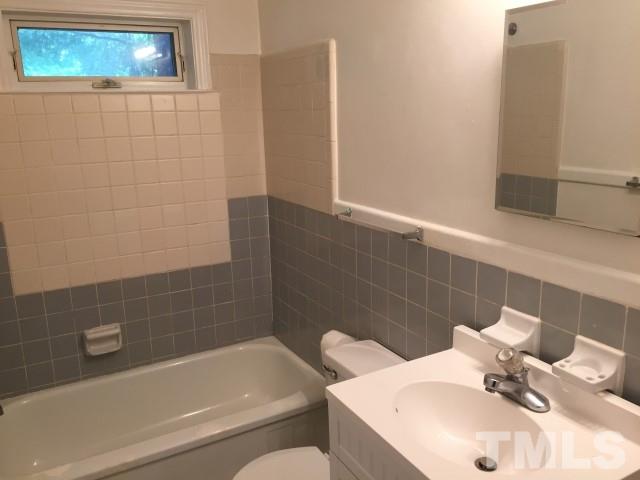 216 Colleton Road Raleigh, NC 27610 - Photo 3 of 11 a bathroom with a sink and bathtub