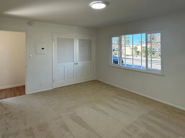 a view of an empty room with a window