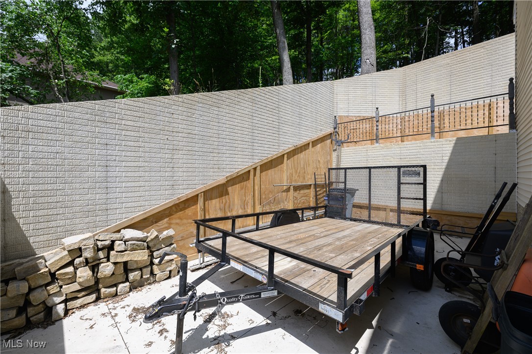 1427 Terrace Road Northwest New Philadelphia, OH 44663 - Photo 12 of 44 View of patio with view of wooded area