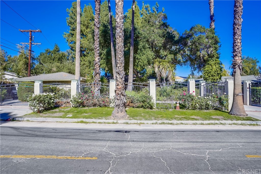 17055 Rancho Street Encino, CA 91316 - Photo 1 of 1 a view of a house with a yard and tree s