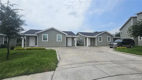 a view of house with a garden