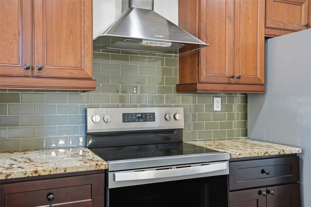 5995 South Shadytree Path Homosassa, FL 34448 - Photo 28 of 64 a kitchen with granite countertop a stove and a sink