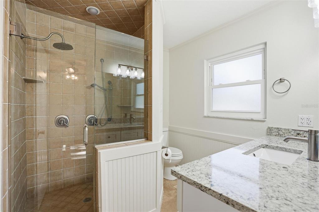 5995 South Shadytree Path Homosassa, FL 34448 - Photo 31 of 64 a bathroom with a granite countertop sink a shower and a mirror