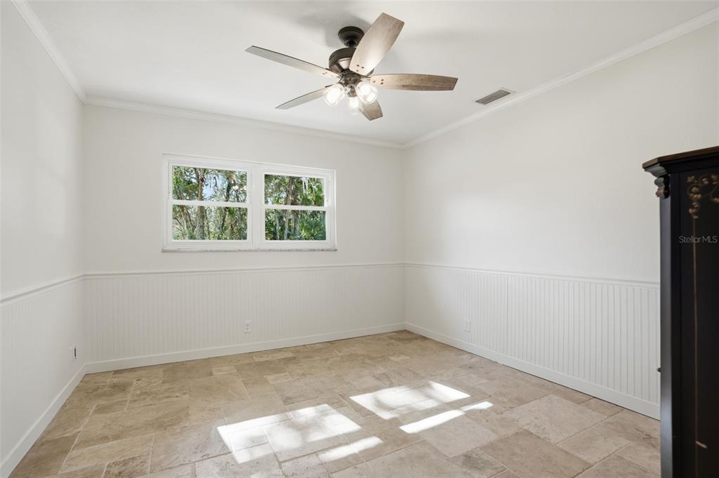 5995 South Shadytree Path Homosassa, FL 34448 - Photo 38 of 64 an empty room with a window and a fan