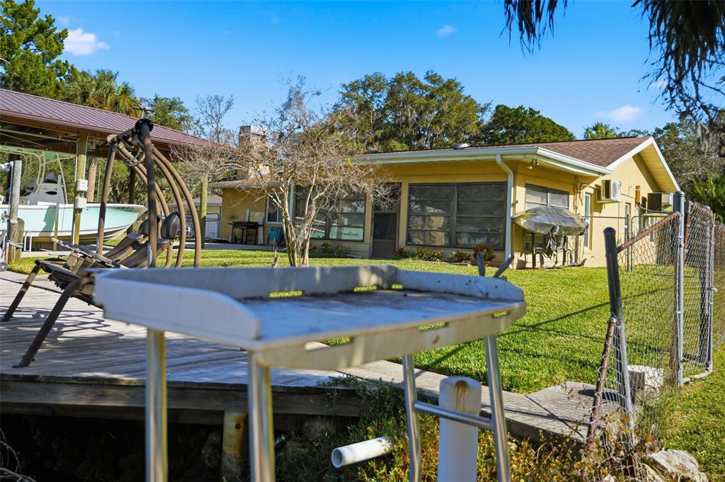 5995 South Shadytree Path Homosassa, FL 34448 - Photo 47 of 64 a view of a house with backyard and sitting area