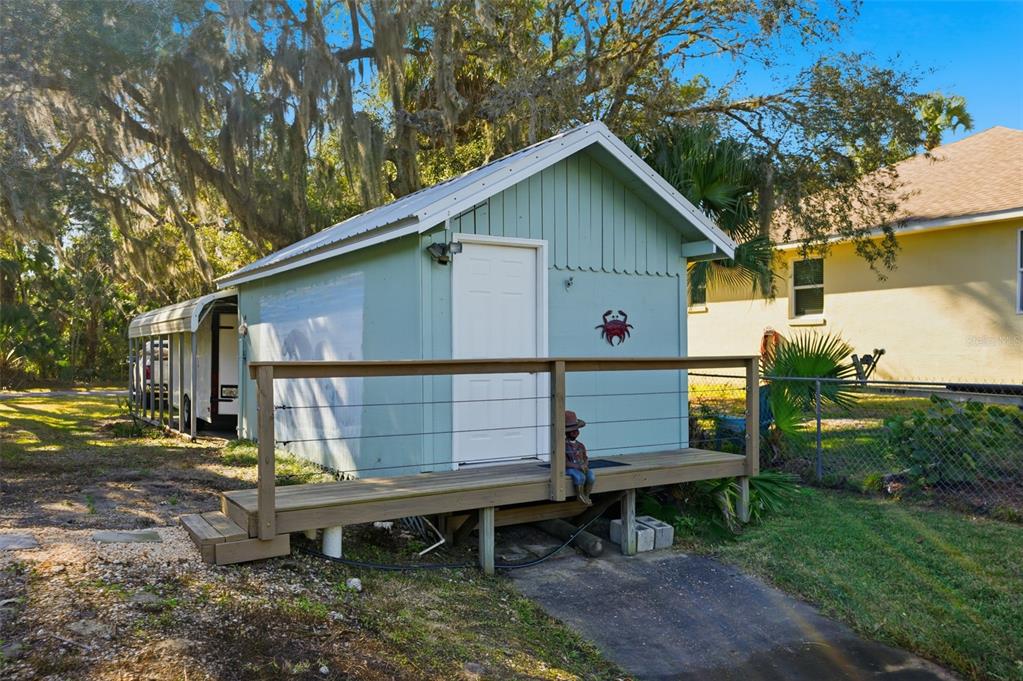 5995 South Shadytree Path Homosassa, FL 34448 - Photo 48 of 64 a front view of a house with garden and sitting area