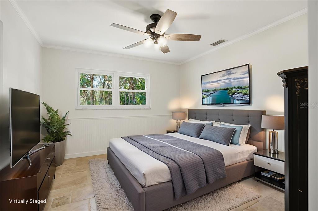 5995 South Shadytree Path Homosassa, FL 34448 - Photo 8 of 64 a bedroom with a large bed and a flat screen tv