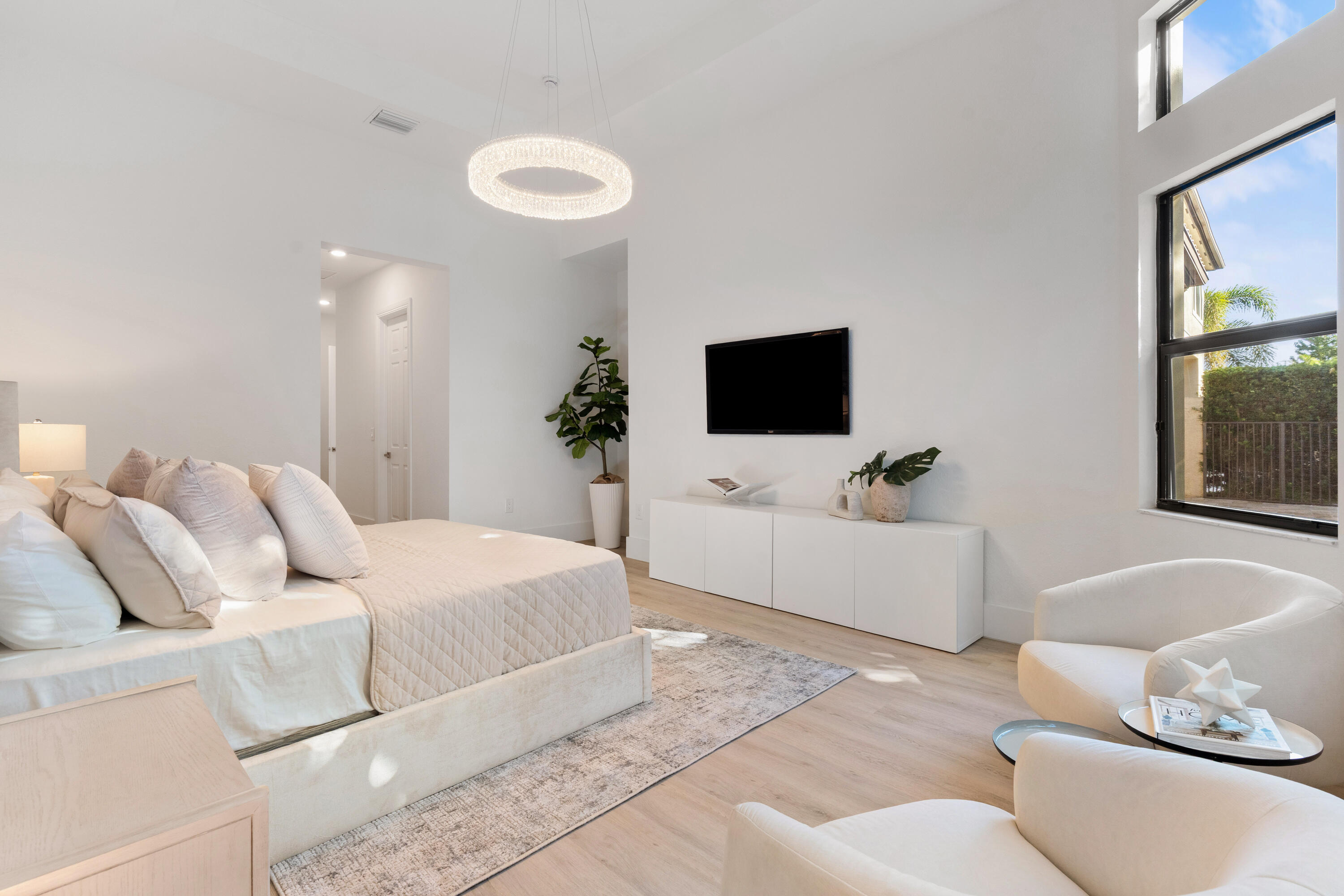 8749 Lewis River Road Delray Beach, FL 33446 - Photo 20 of 32 a living room with furniture and a flat screen tv