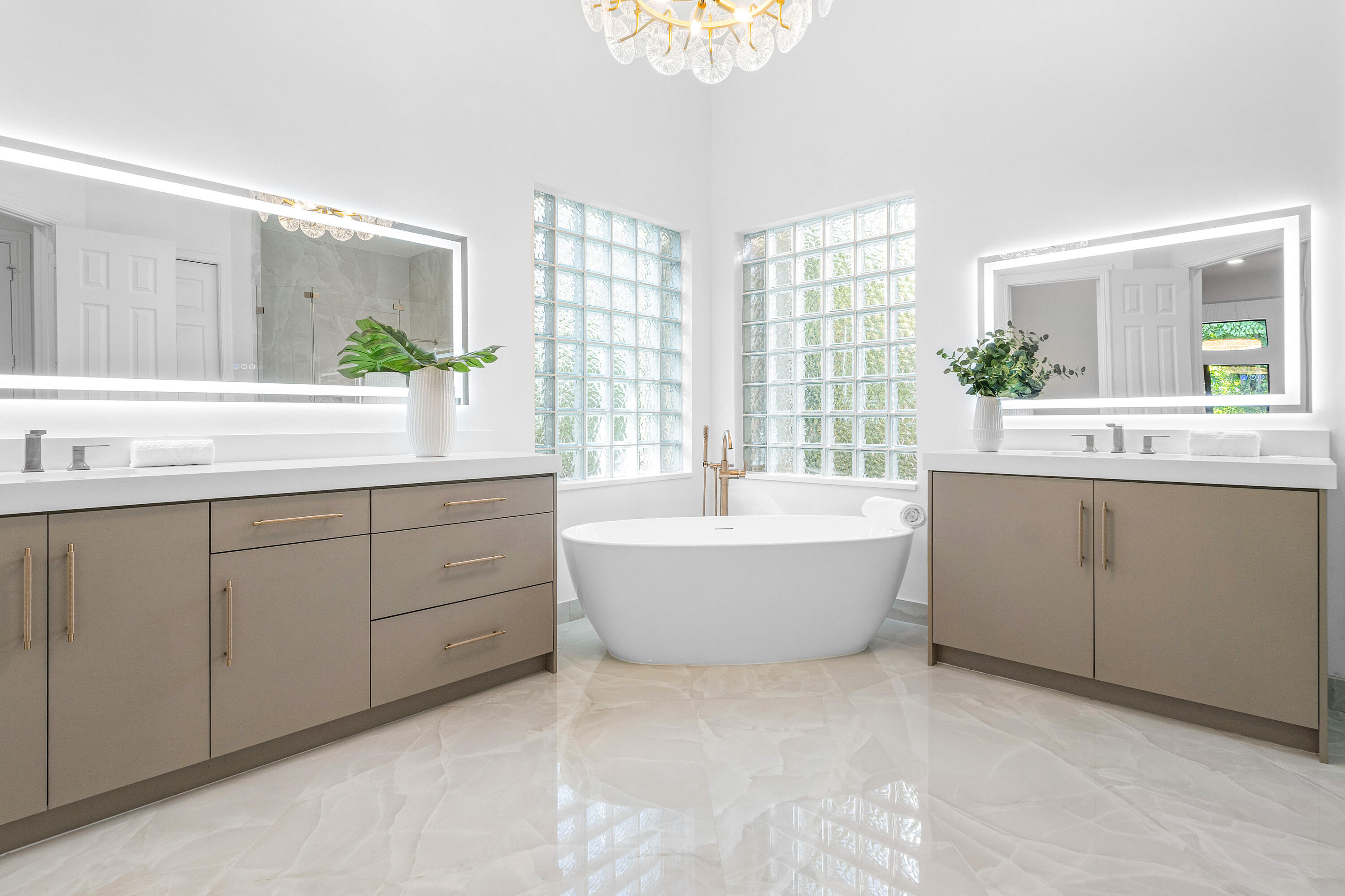 8749 Lewis River Road Delray Beach, FL 33446 - Photo 21 of 32 a bath room with a sink double vanity mirror and a bathtub