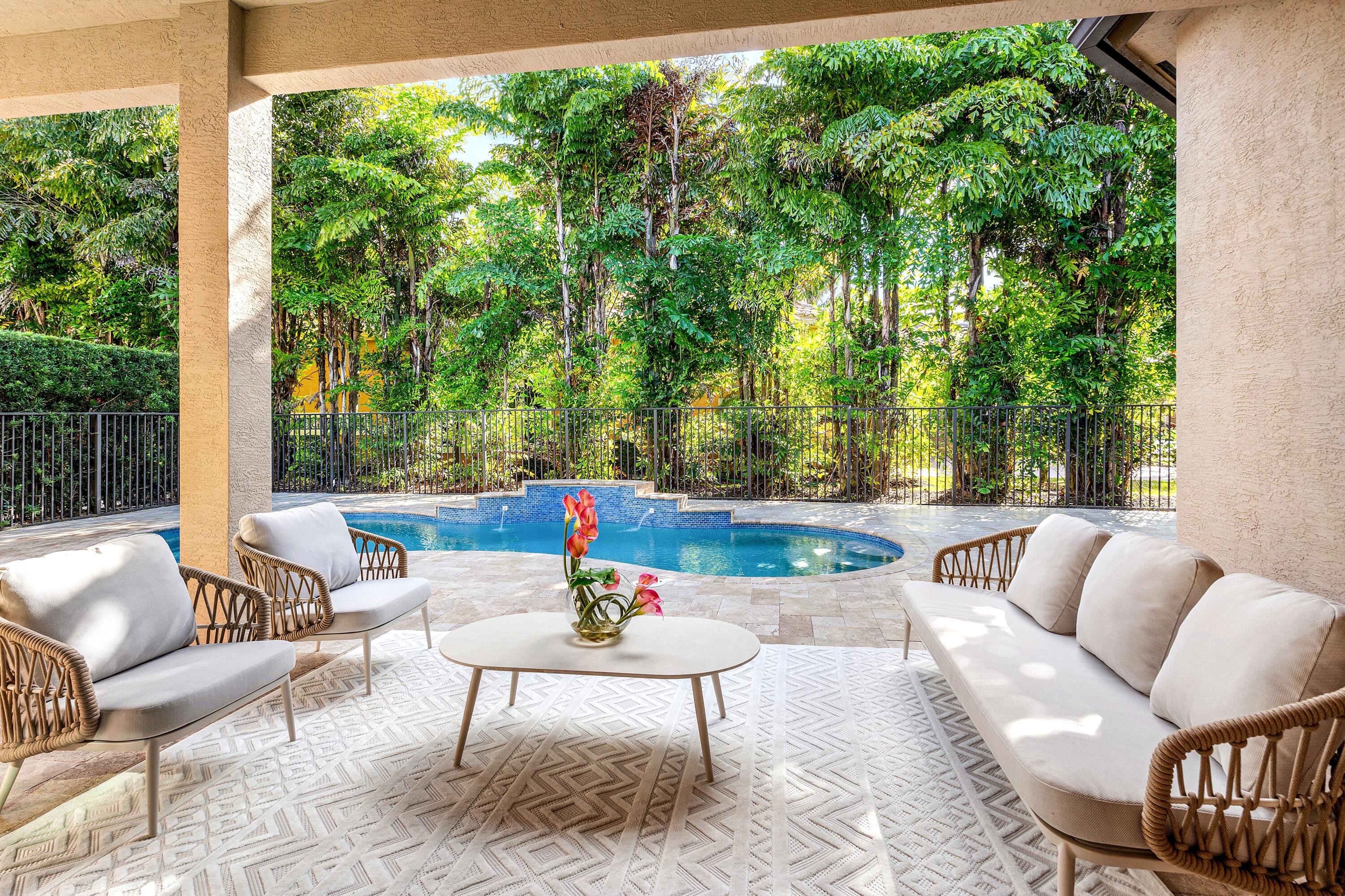 8749 Lewis River Road Delray Beach, FL 33446 - Photo 32 of 32 a view of patio with couches and dining table