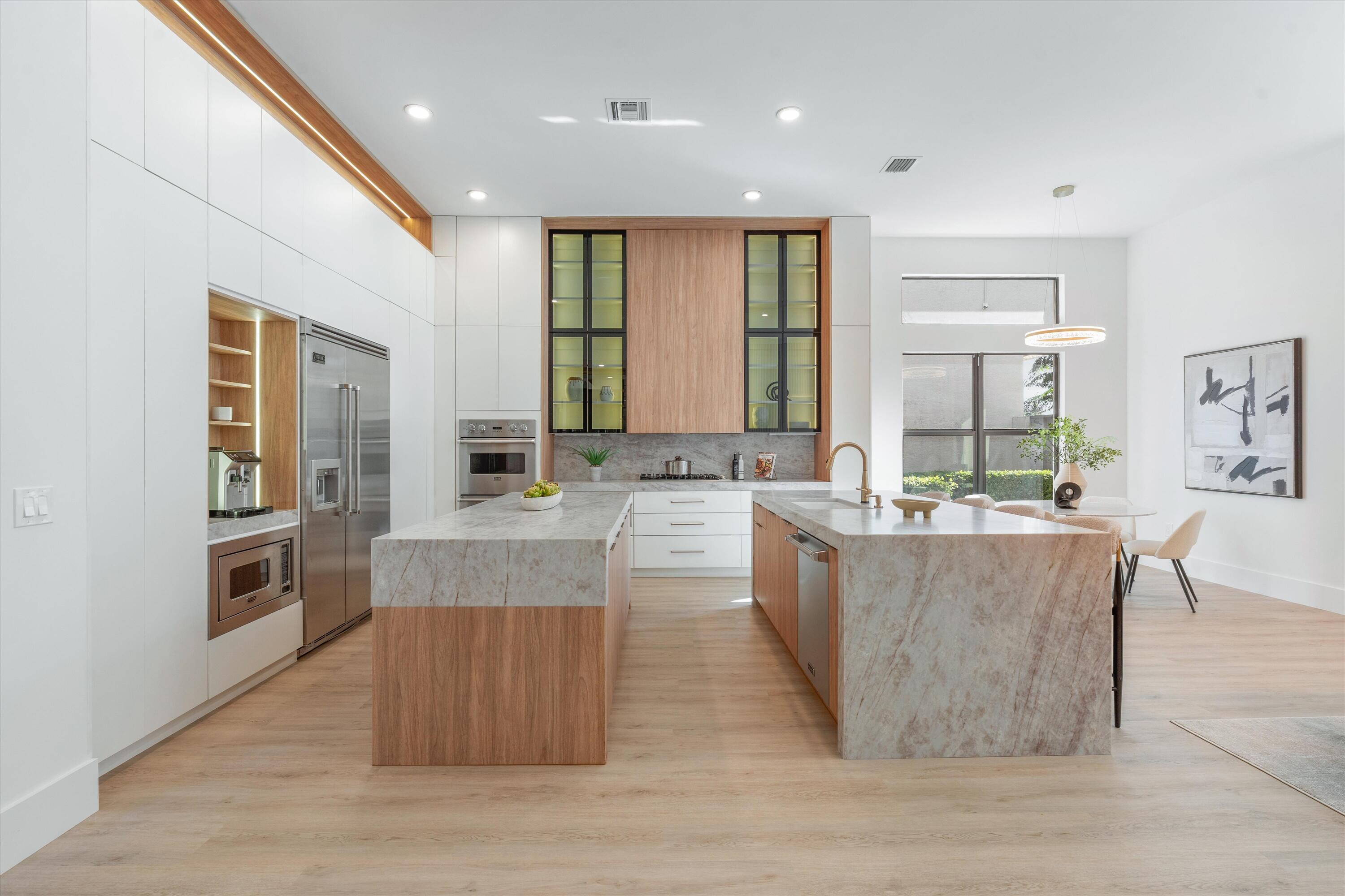 8749 Lewis River Road Delray Beach, FL 33446 - Photo 6 of 32 a living room with kitchen island furniture and wooden floor
