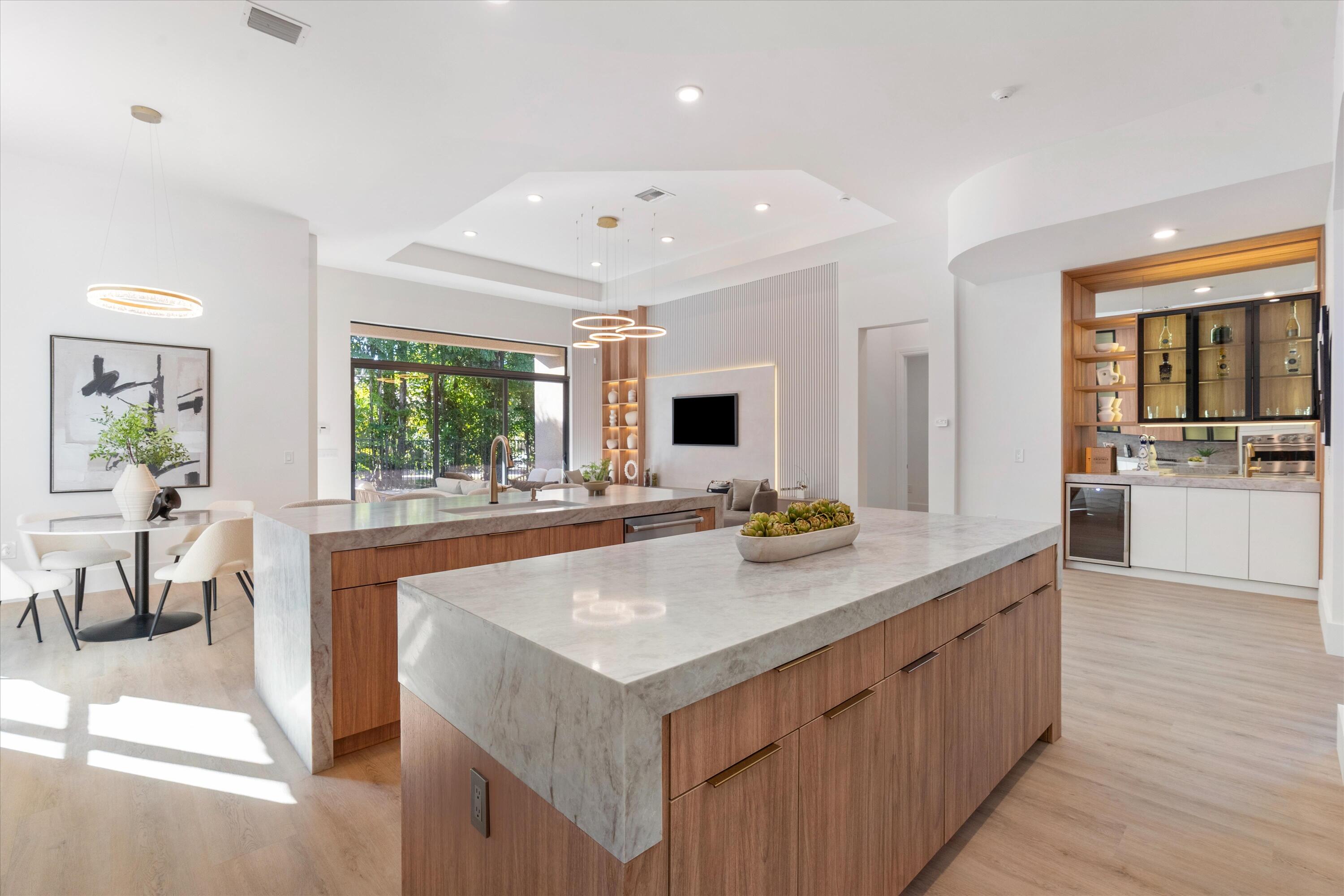 8749 Lewis River Road Delray Beach, FL 33446 - Photo 8 of 32 a view of a kitchen counter space and wooden floor