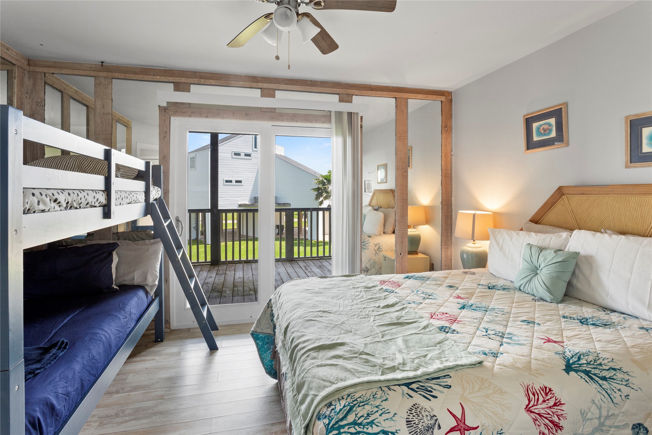 17627 Termini-San Luis Pass Road Galveston, TX 77554 - Photo 16 of 28 Guest bedroom with rustic, mirrored walls. Queen bed plus twin bunks - comfortably sleeps 4