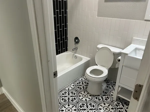 a bathroom with a toilet and a sink