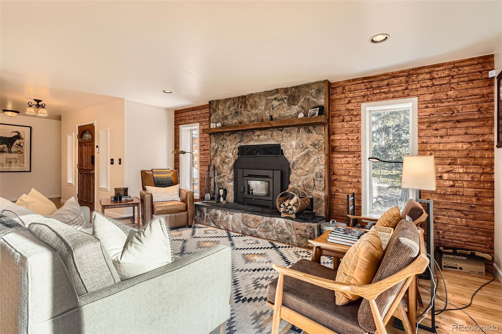a living room with furniture and a fireplace