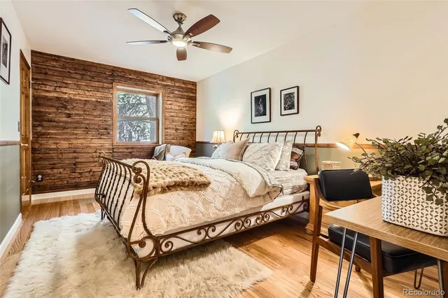 a bedroom with a bed and a desk