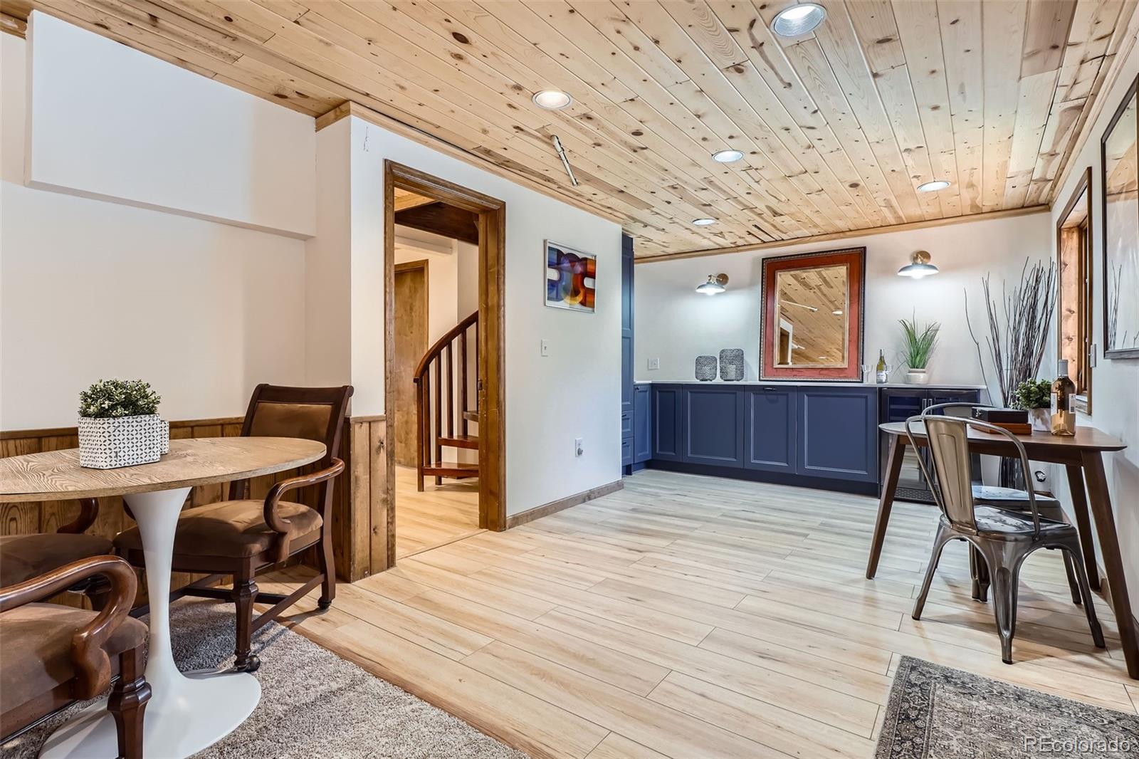 10439 Christopher Drive Conifer, CO 80433 - Photo 17 of 32 a view of a dining room with furniture and wooden floor