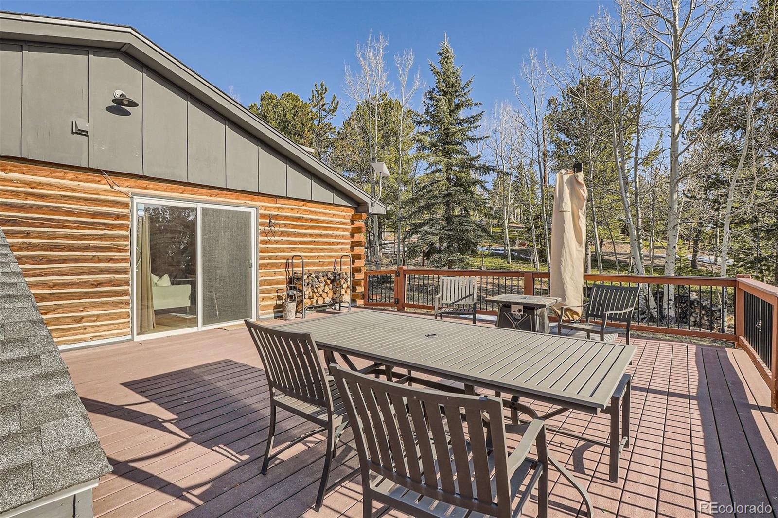 10439 Christopher Drive Conifer, CO 80433 - Photo 27 of 32 a deck view with a seating space