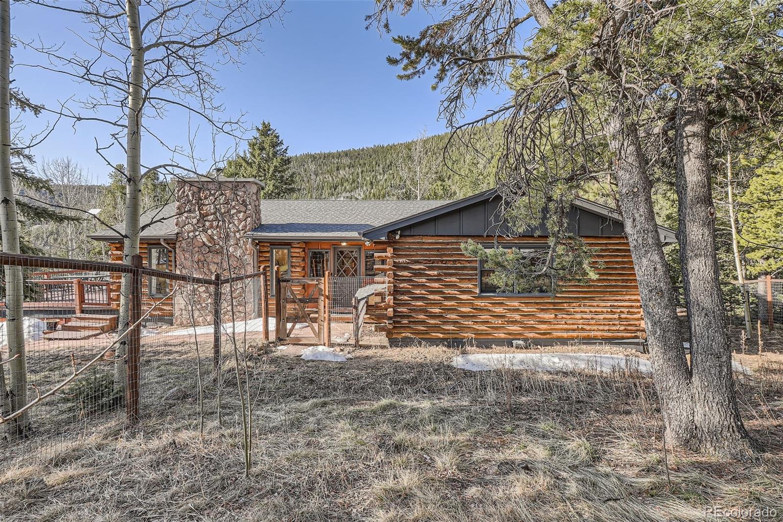 10439 Christopher Drive Conifer, CO 80433 - Photo 3 of 32 a view of a house with a tree