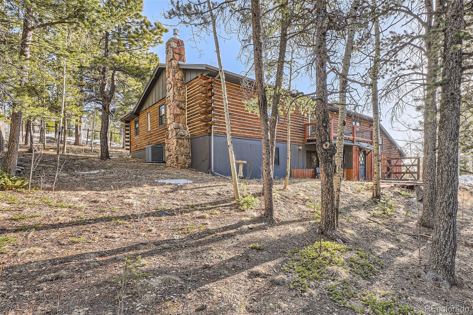 10439 Christopher Drive Conifer, CO 80433 - Photo 31 of 32 a view of a house with a yard