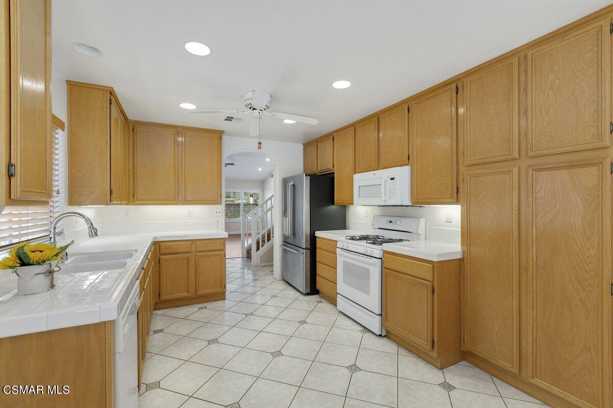 Undisclosed Address Simi Valley, CA 93063 - Photo 11 of 29 a large kitchen with a window a counter top space stainless steel appliances and cabinets