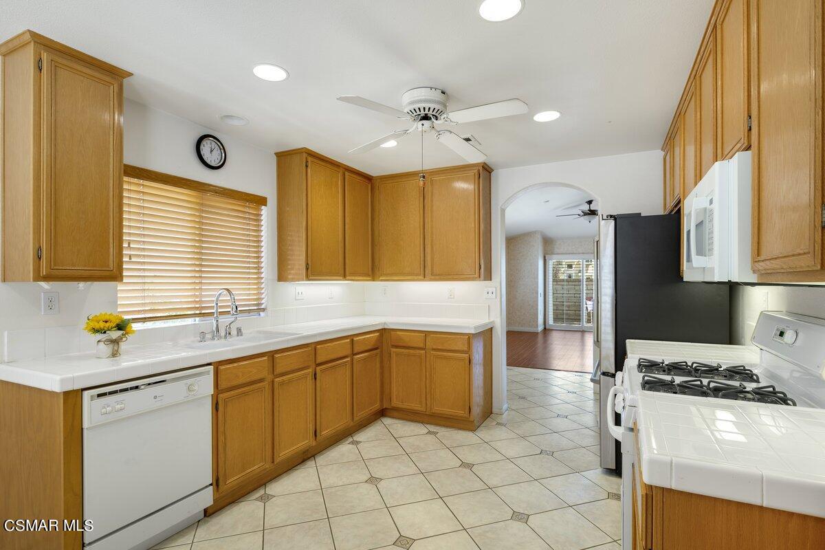 Undisclosed Address Simi Valley, CA 93063 - Photo 13 of 29 a kitchen with a sink appliances and cabinets