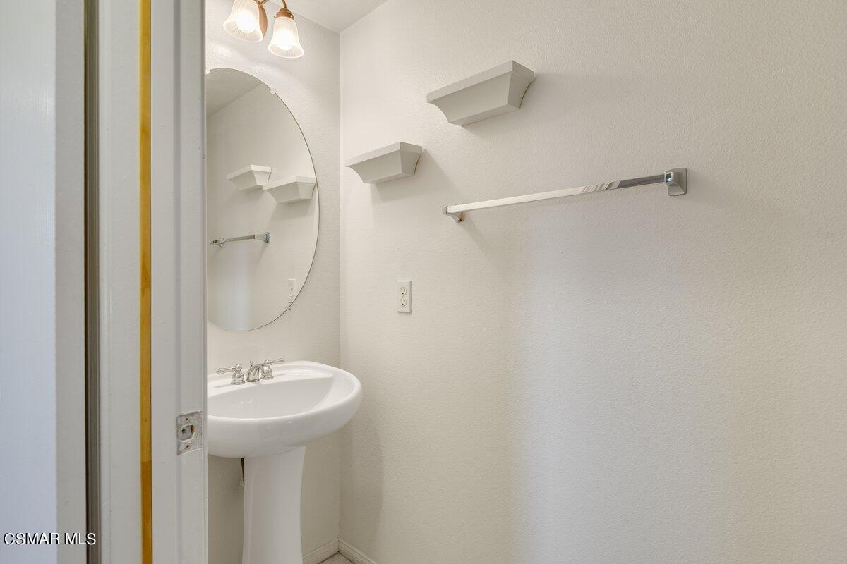 Undisclosed Address Simi Valley, CA 93063 - Photo 14 of 29 a bathroom with a sink and mirror