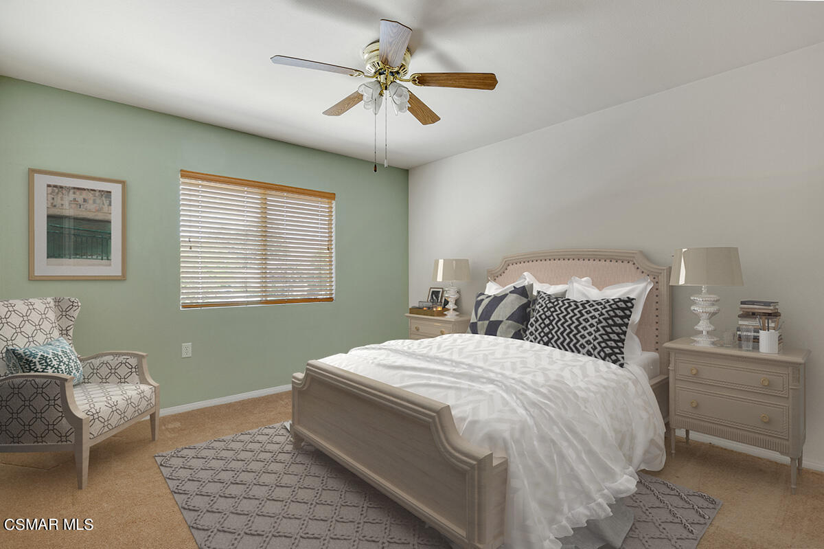 Undisclosed Address Simi Valley, CA 93063 - Photo 16 of 29 a bedroom with a bed and a chandelier