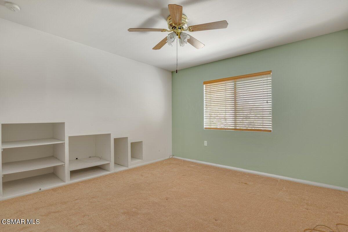 Undisclosed Address Simi Valley, CA 93063 - Photo 19 of 29 an empty room with a ceiling fan and window
