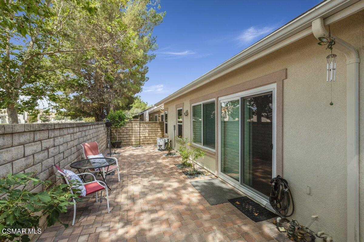 Undisclosed Address Simi Valley, CA 93063 - Photo 21 of 29 a backyard of a house with outdoor seating