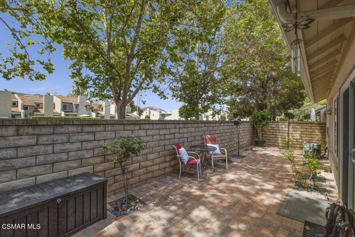 Undisclosed Address Simi Valley, CA 93063 - Photo 22 of 29 a view of a patio with table and chairs and potted plants
