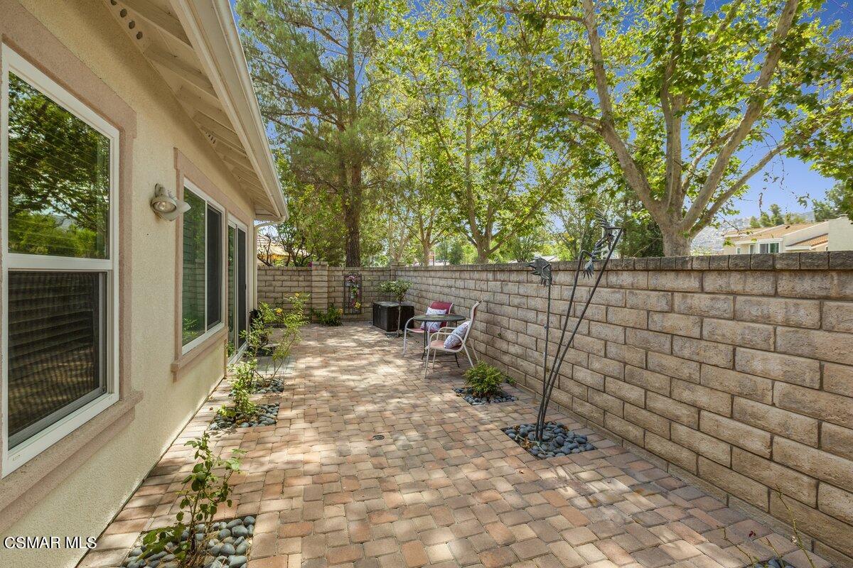 Undisclosed Address Simi Valley, CA 93063 - Photo 24 of 29 a backyard of a house with table and chairs