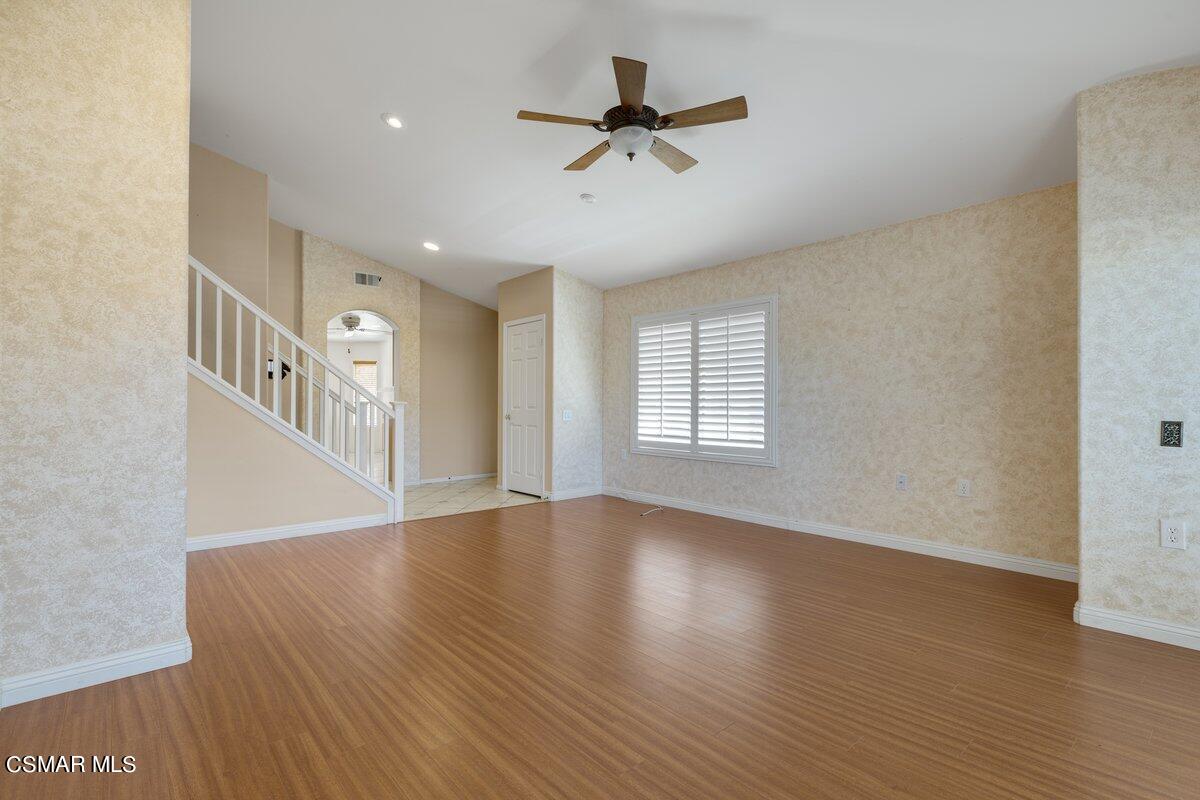 Undisclosed Address Simi Valley, CA 93063 - Photo 4 of 29 a view of an empty room with wooden floor and a window