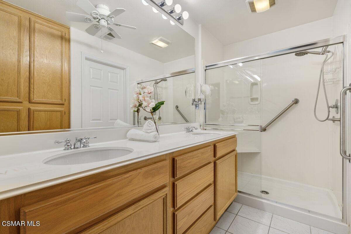 Undisclosed Address Simi Valley, CA 93063 - Photo 10 of 29 a bathroom with a double vanity sink mirror and shower