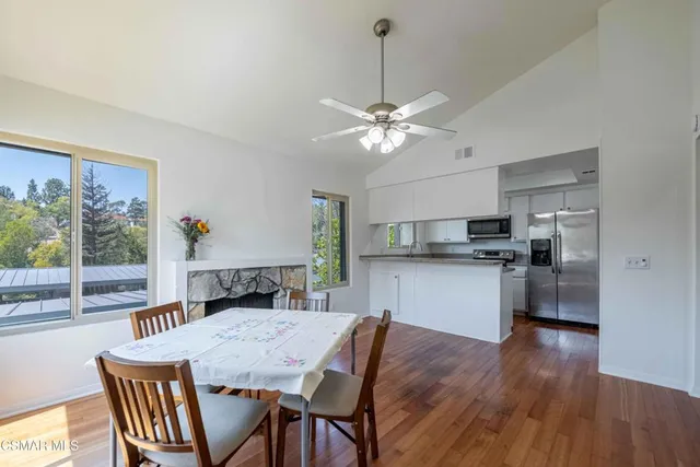 a view of a dining room with furniture window and wooden floor