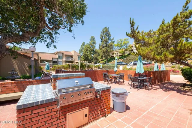 a outdoor space with patio furniture and a fire pit