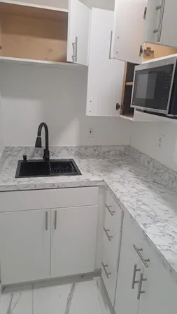 a living room with a table and chairs