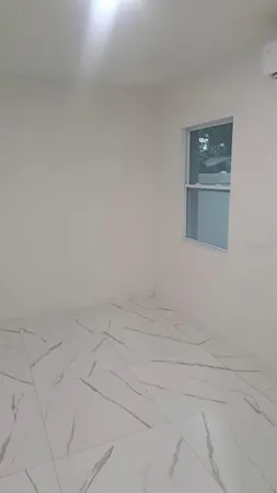 a bathroom with a glass door shower