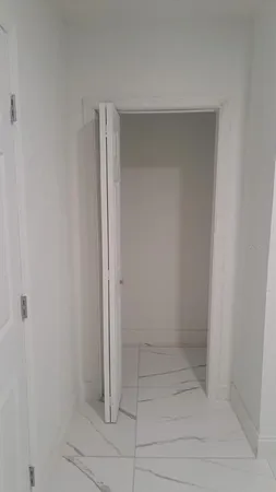 a white toilet sitting next to a bathroom sink