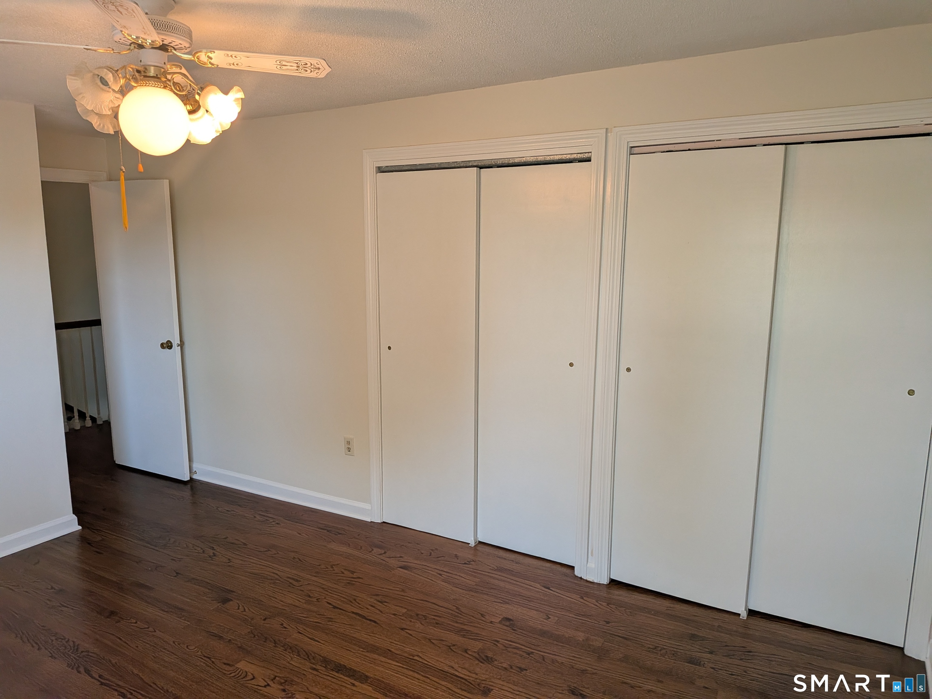 124 Spring Lake Road Waterbury, CT 06706 - Photo 14 of 34 Bank of double closets in Primary bedroom