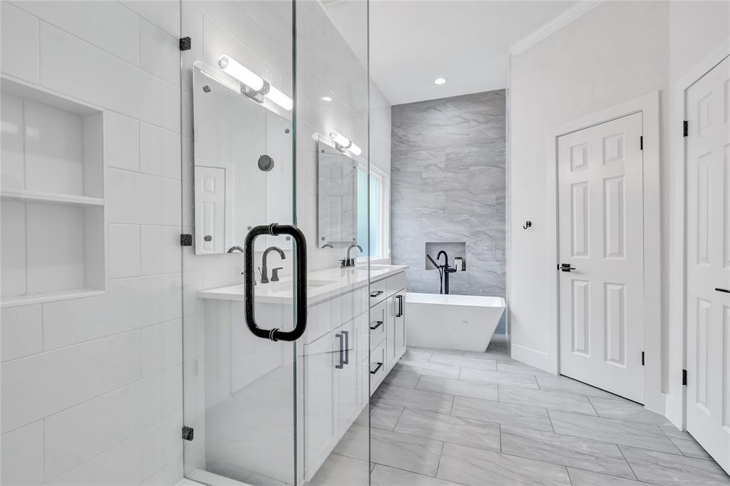 3600 Rip Ford Drive Austin, TX 78732 - Photo 22 of 32 a spacious bathroom with a tub shower and mirror