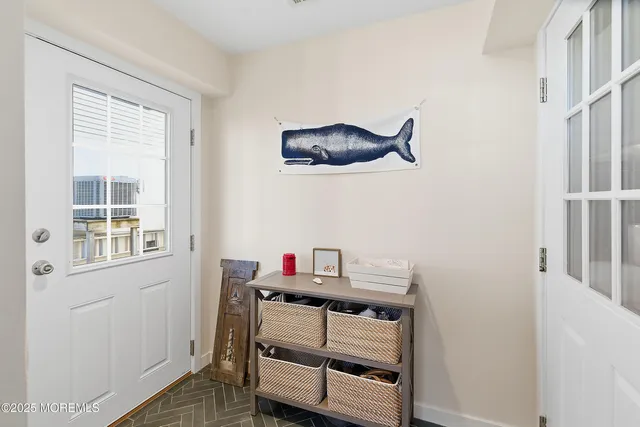 a view of a house with backyard and a tree