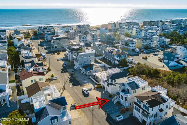 a view of staircase with white walls and windows