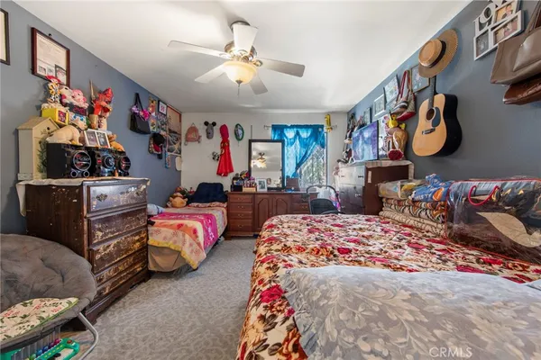 a bedroom with bed and cabinets