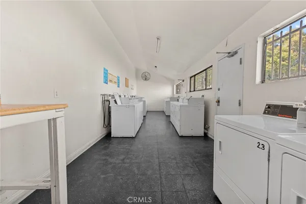 a view of storage and utility room with racks on the wall
