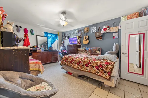 a bedroom with furniture and a chandelier
