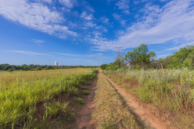 a view of a lake with a yard
